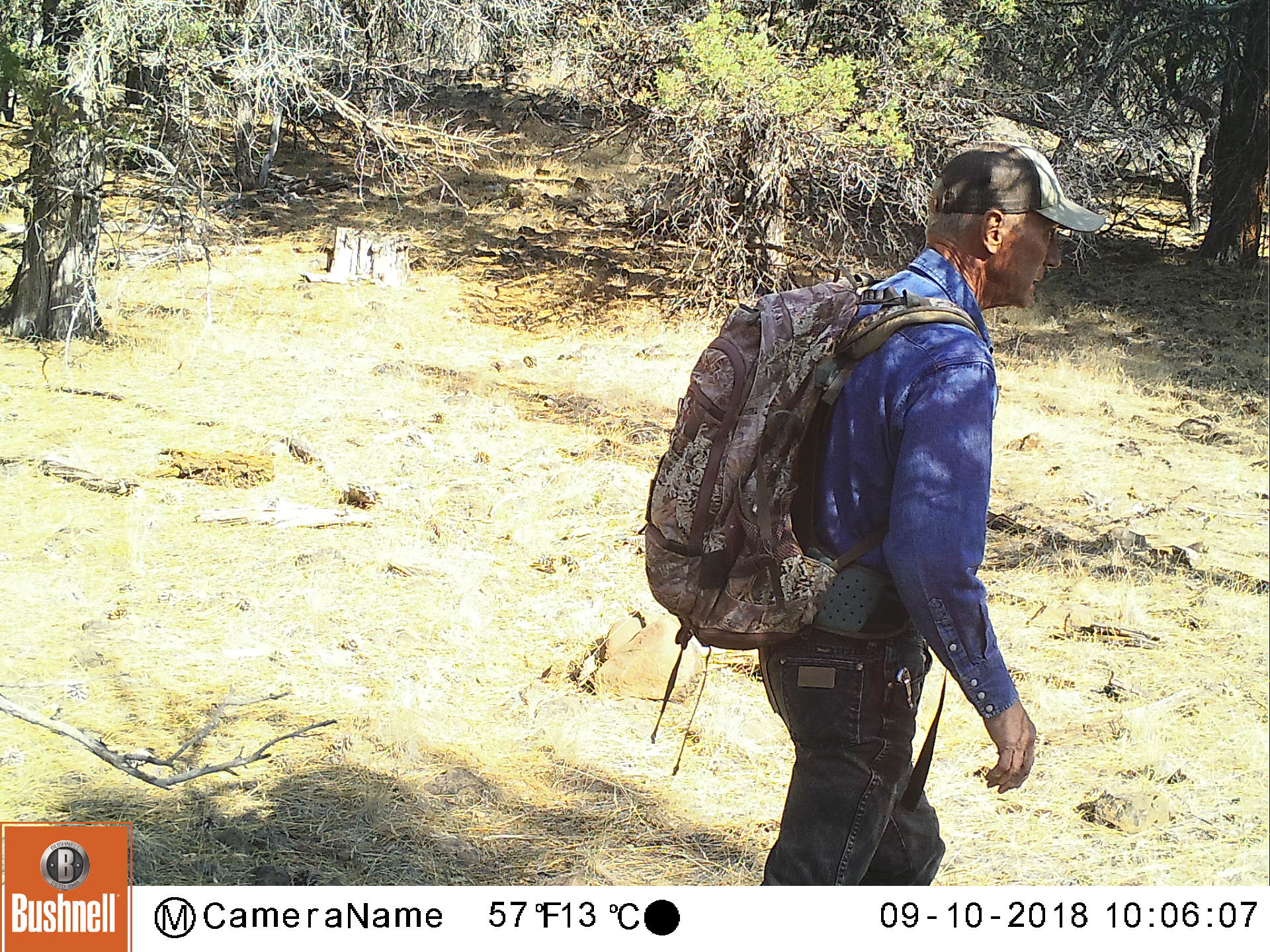 Patrick hiking by triggers a trail camera