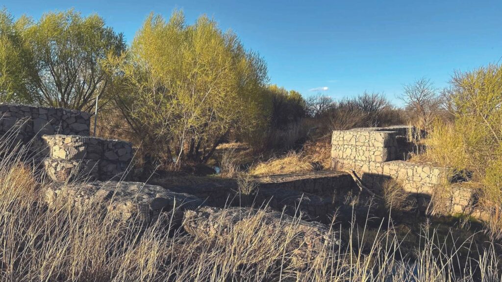 Rock detention structures installed in series at El Coronado Ranch, Pearce, Arizona, looking upstream.