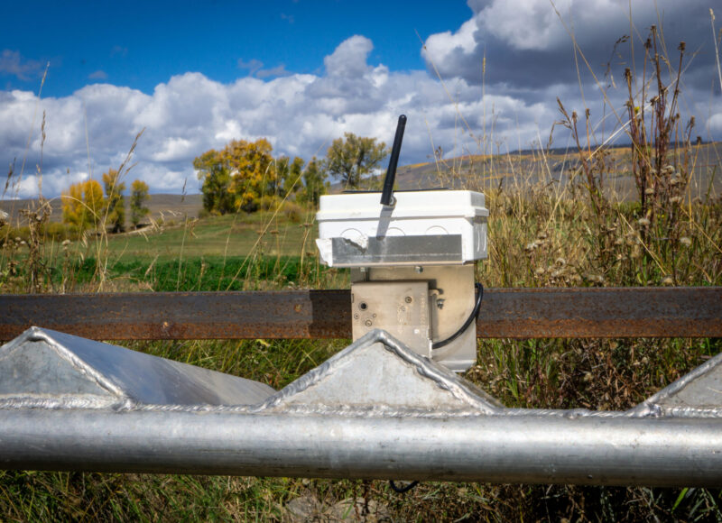 An auto-tarp system in place on a ditch.