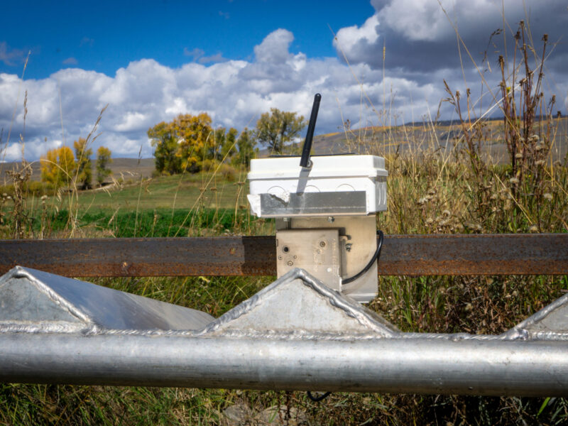 An auto-tarp system in place on a ditch.