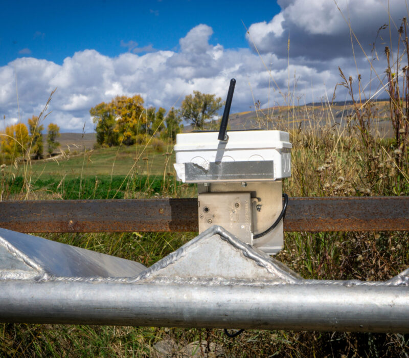 An auto-tarp system in place on a ditch.