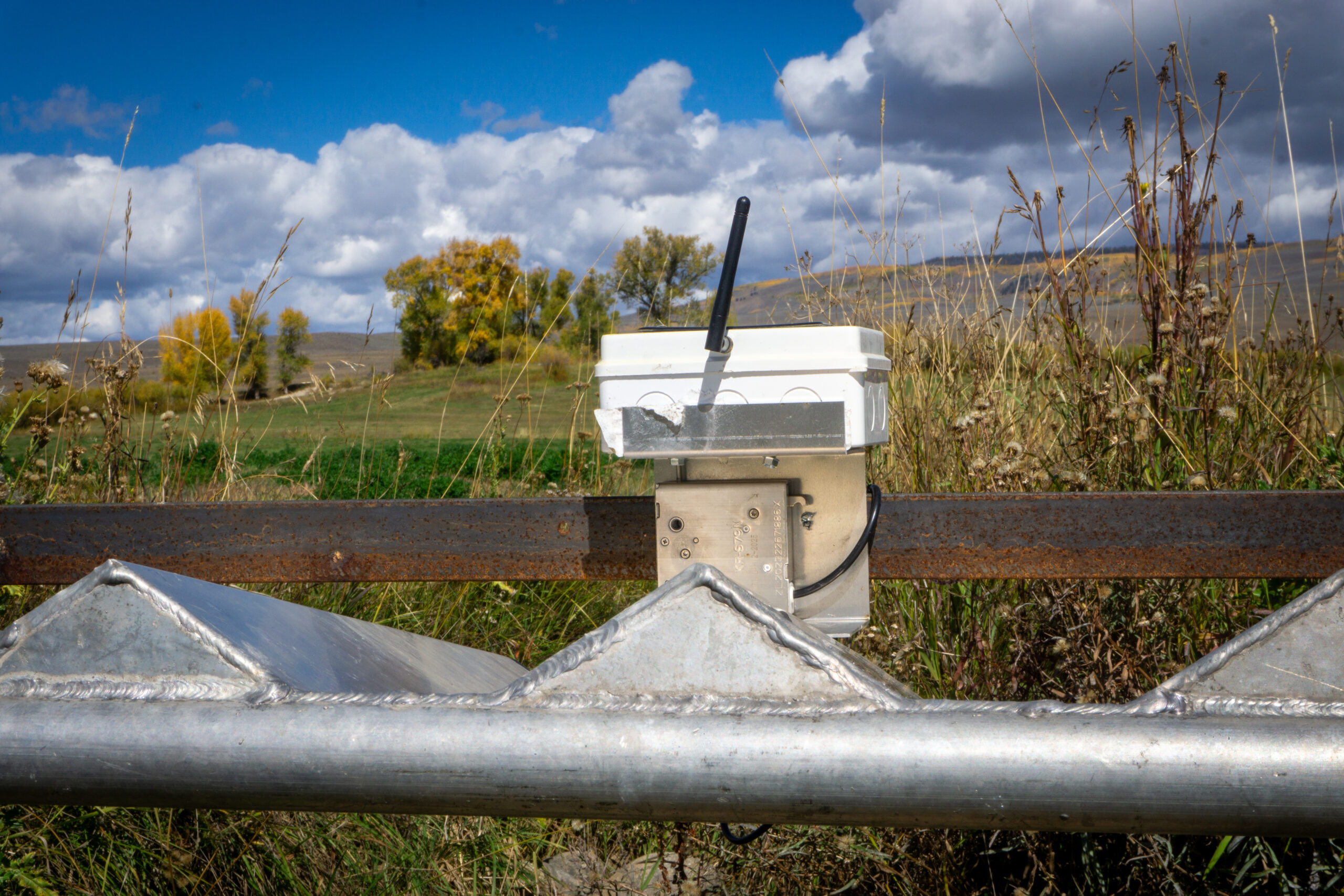An auto-tarp system in place on a ditch.